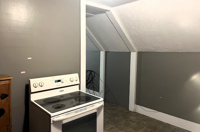 kitchen with white electric range oven, lofted ceiling, and a textured ceiling