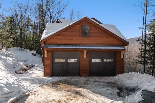 view of snow covered garage