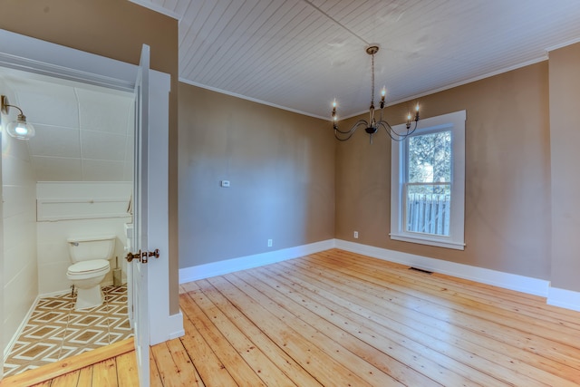 interior space featuring light hardwood / wood-style floors and a notable chandelier