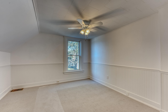 interior space featuring ceiling fan and light colored carpet