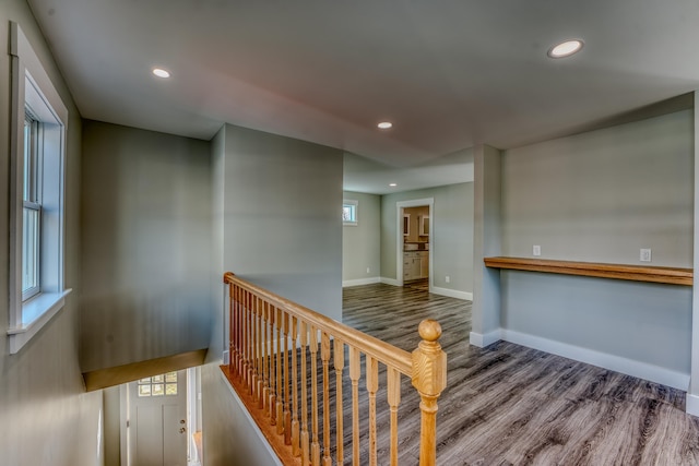 corridor with wood-type flooring