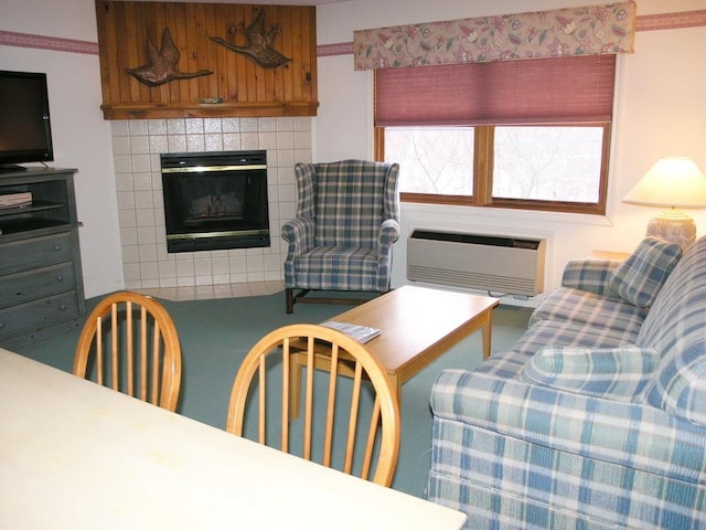 living room with a tiled fireplace