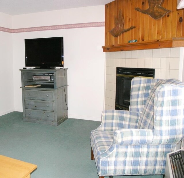 living room featuring dark colored carpet