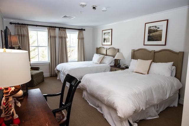 carpeted bedroom with ornamental molding