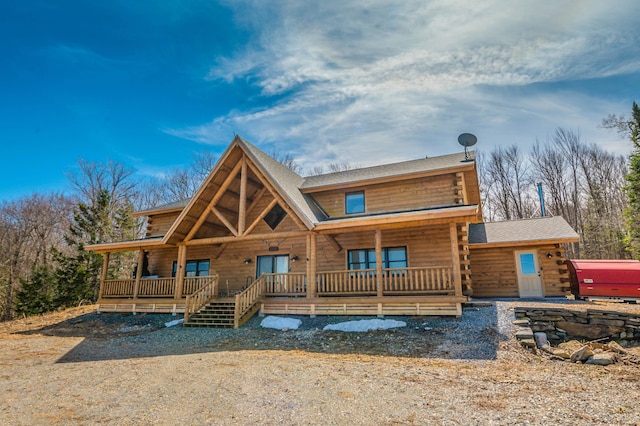 log cabin featuring a porch