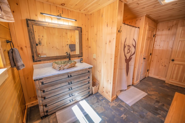 bathroom featuring hardwood / wood-style floors, vanity, wood walls, and wooden ceiling