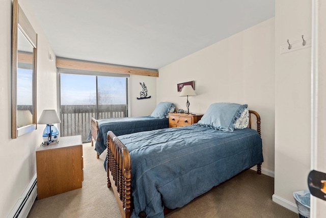 carpeted bedroom with baseboard heating