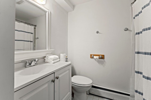 bathroom featuring tile patterned floors, vanity, a baseboard radiator, and toilet