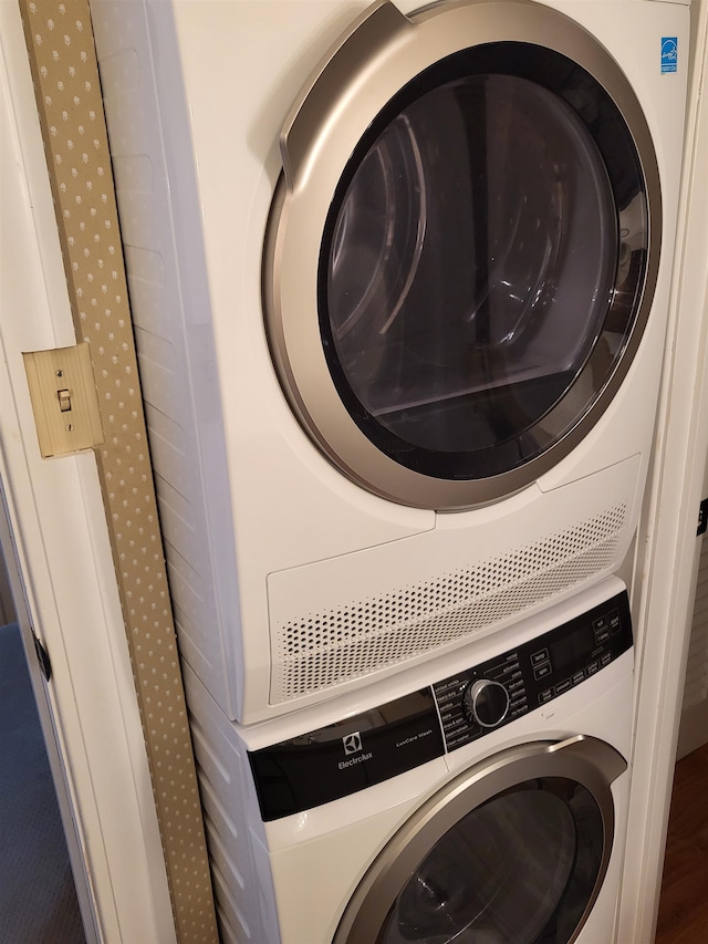 laundry area with stacked washer / drying machine