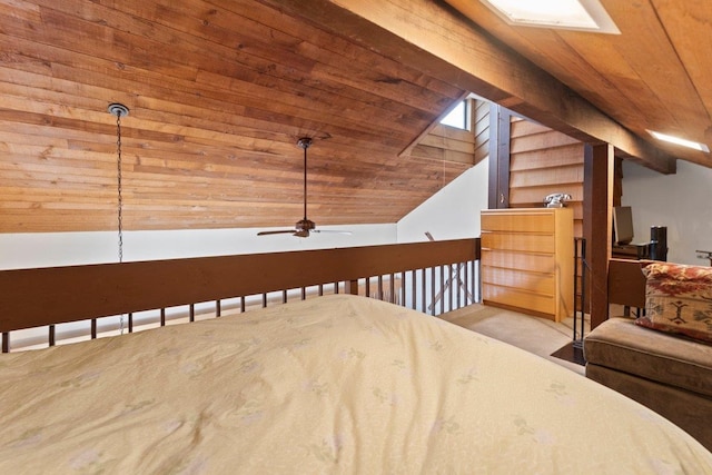 unfurnished bedroom with vaulted ceiling with beams, light carpet, ceiling fan, and wooden ceiling