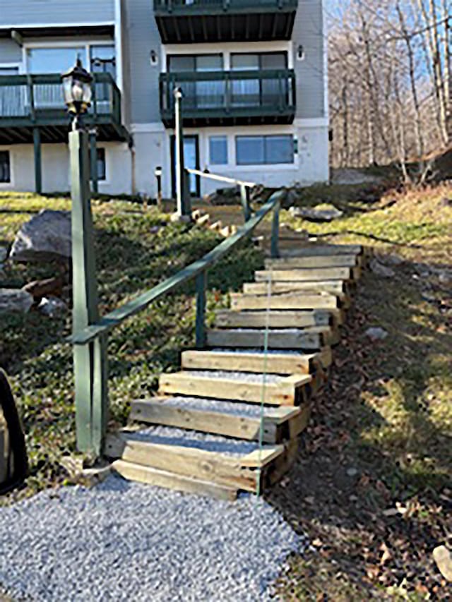 rear view of property featuring a balcony