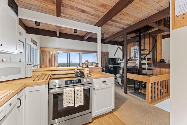 kitchen with white cabinetry, wood counters, beamed ceiling, decorative light fixtures, and white appliances