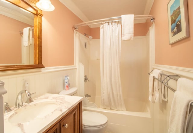 full bathroom featuring toilet, vanity, ornamental molding, and shower / tub combo with curtain