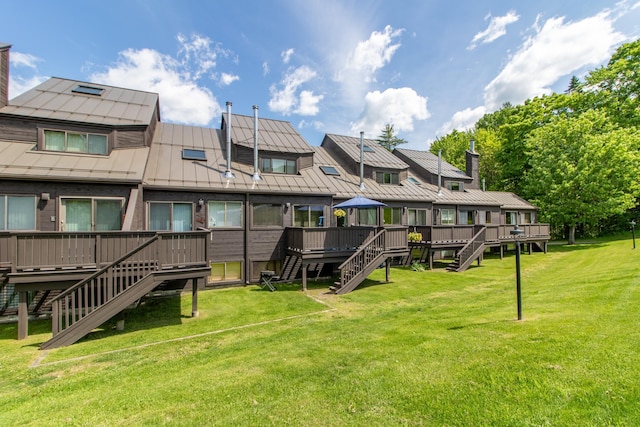 surrounding community with a yard and a wooden deck