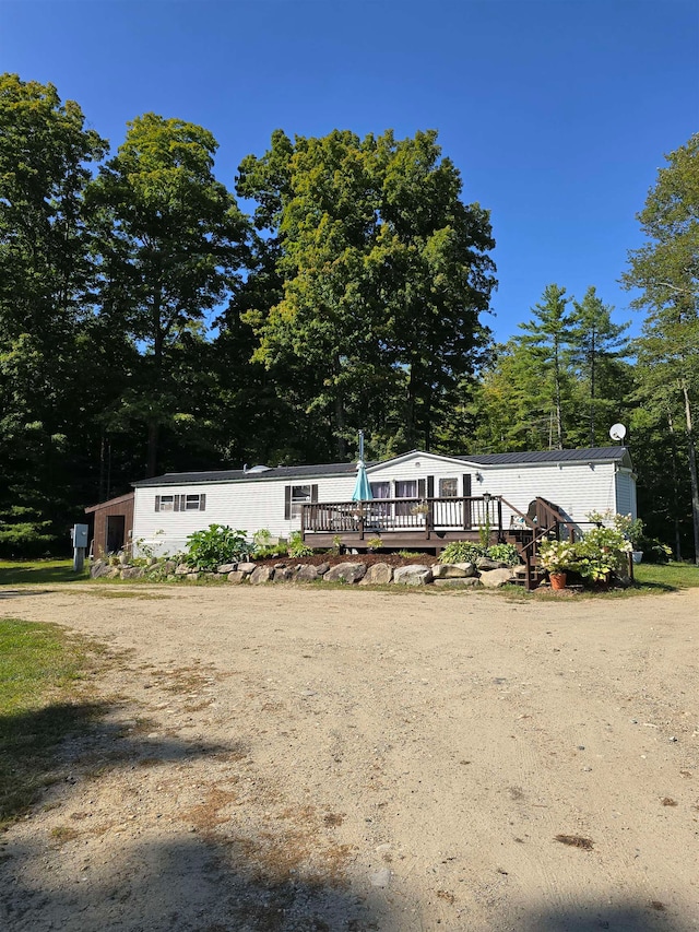 view of front of property featuring a wooden deck