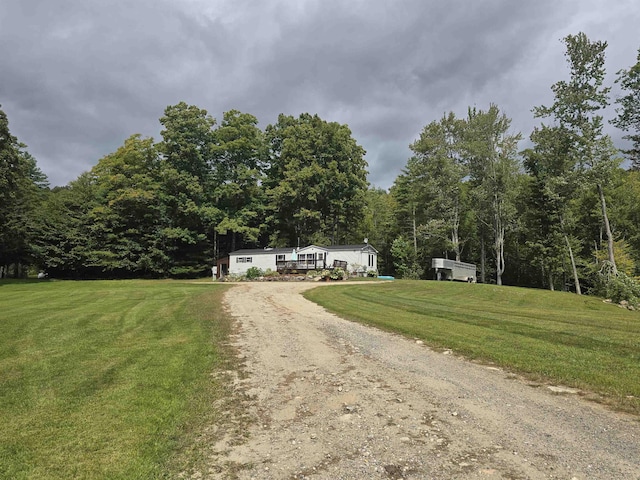 view of front facade with a front yard and driveway