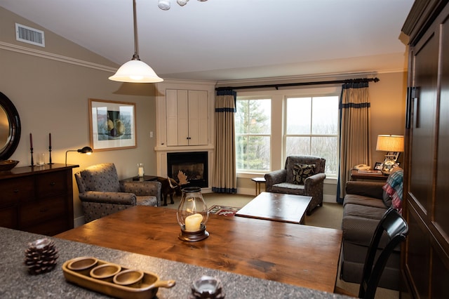 dining room with carpet flooring and lofted ceiling