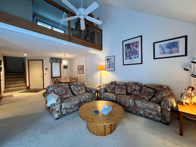 living room with ceiling fan, carpet, and high vaulted ceiling