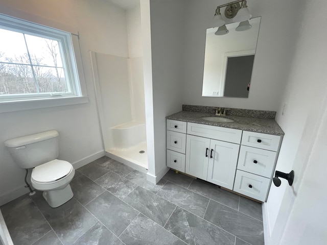 bathroom featuring toilet, walk in shower, tile patterned floors, and vanity