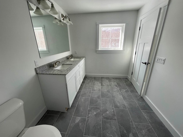 bathroom with tile patterned floors, toilet, and vanity