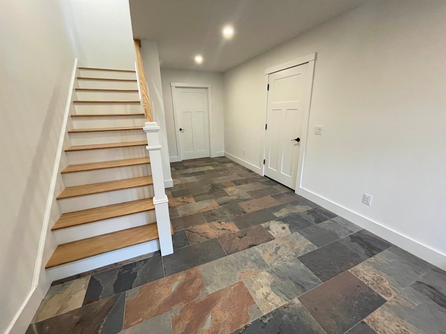 staircase featuring tile patterned floors