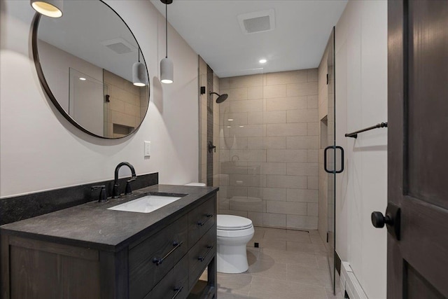 bathroom featuring toilet, an enclosed shower, vanity, and tile patterned flooring