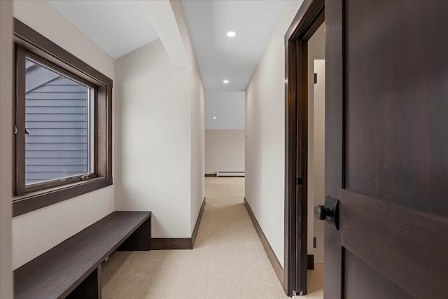 hall featuring light colored carpet and a baseboard radiator