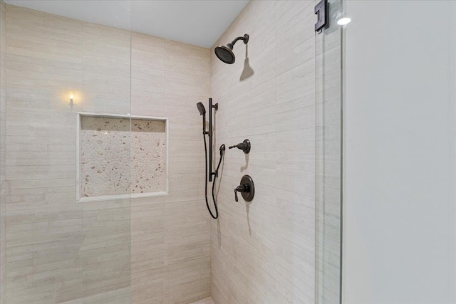 room details featuring a tile shower