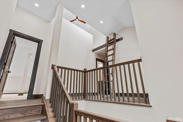 staircase with vaulted ceiling