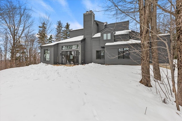 view of snow covered house