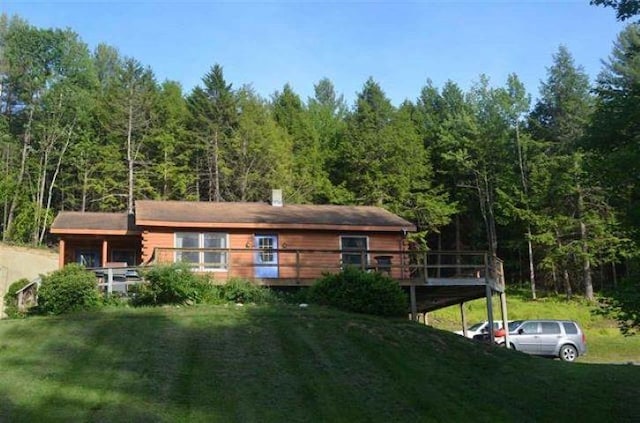 17 Tracy Hill Rd, Northfield, VT 05663 - rear view of property featuring a forest view, a yard, and a wooden deck