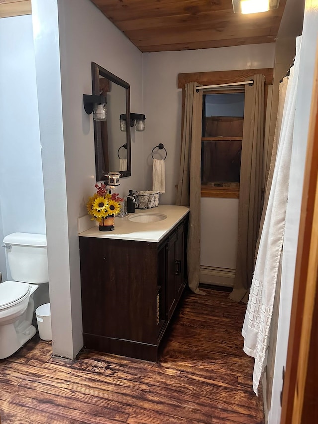 17 Tracy Hill Rd, Northfield, VT 05663 - bathroom featuring vanity, toilet, wood finished floors, and wooden ceiling