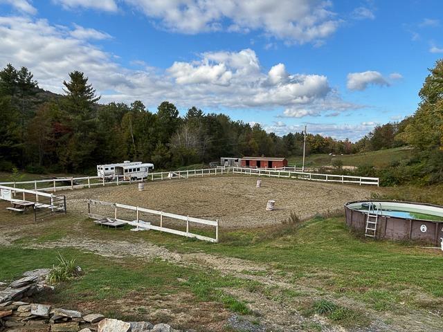 17 Tracy Hill Rd, Northfield, VT 05663 - surrounding community with an enclosed riding area, a forest view, a swimming pool, and a rural view