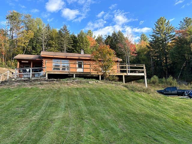 17 Tracy Hill Rd, Northfield, VT 05663 - rear view of property with a yard and a wooded view