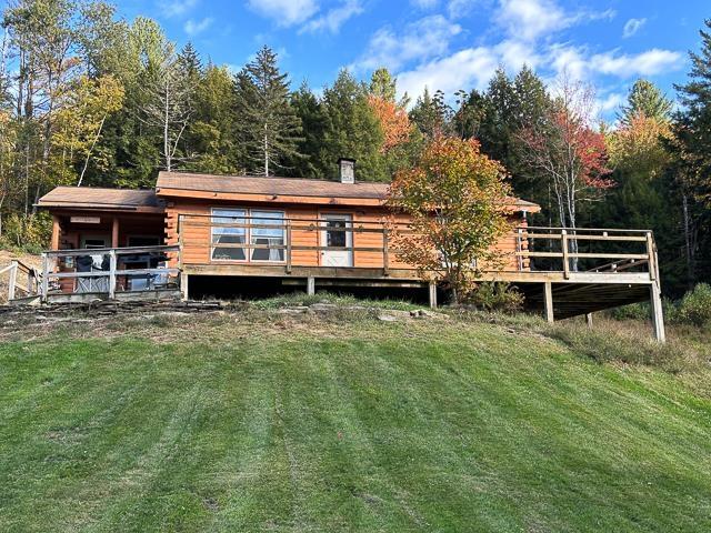 17 Tracy Hill Rd, Northfield, VT 05663 - back of house with a lawn, a forest view, and log siding