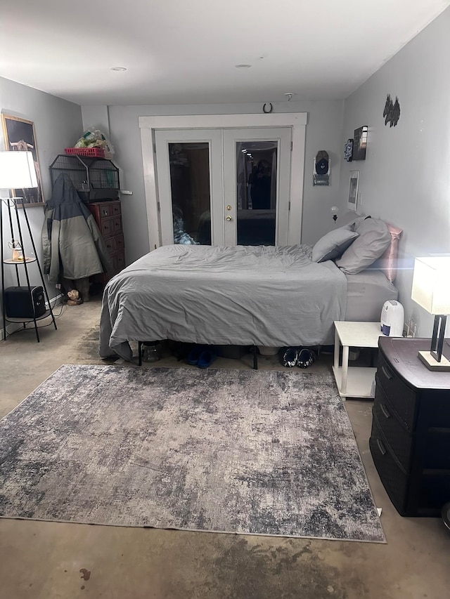 17 Tracy Hill Rd, Northfield, VT 05663 - bedroom featuring unfinished concrete flooring and french doors
