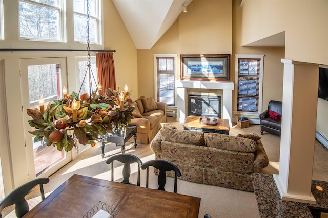 carpeted living room featuring high vaulted ceiling