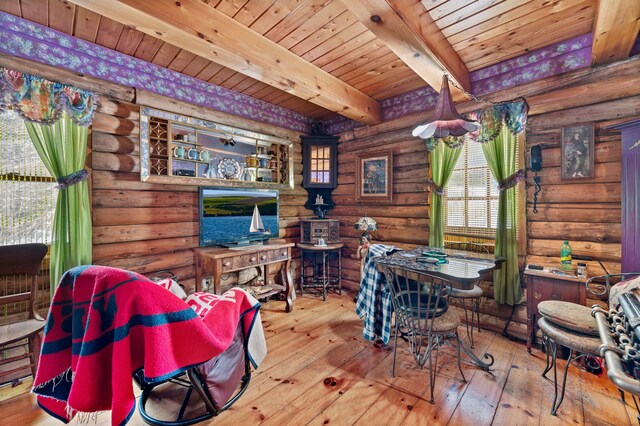 interior space featuring rustic walls and light hardwood / wood-style flooring