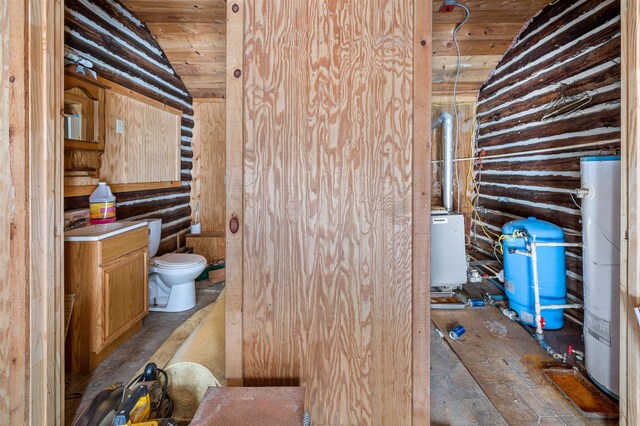 interior space featuring light tile floors and wood ceiling