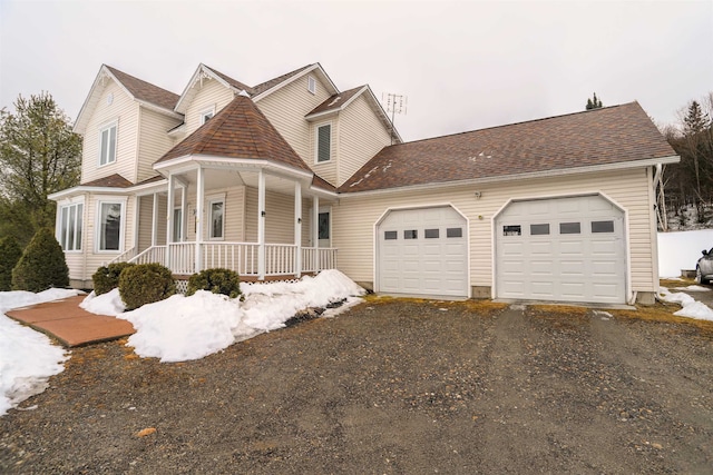 view of front of property with a garage and covered porch