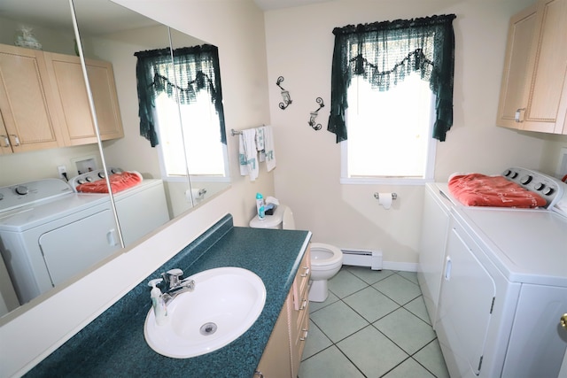 bathroom featuring a baseboard radiator, separate washer and dryer, tile patterned flooring, vanity, and toilet