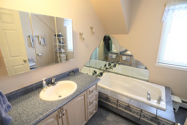 bathroom with a relaxing tiled tub, tile patterned floors, plenty of natural light, and vanity