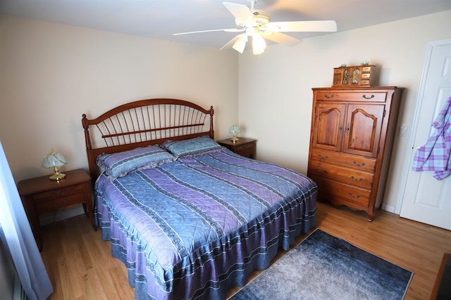 bedroom featuring ceiling fan and hardwood / wood-style floors