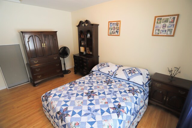 bedroom with light hardwood / wood-style floors