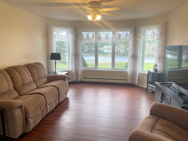 living room with ceiling fan, a baseboard radiator, and dark hardwood / wood-style floors