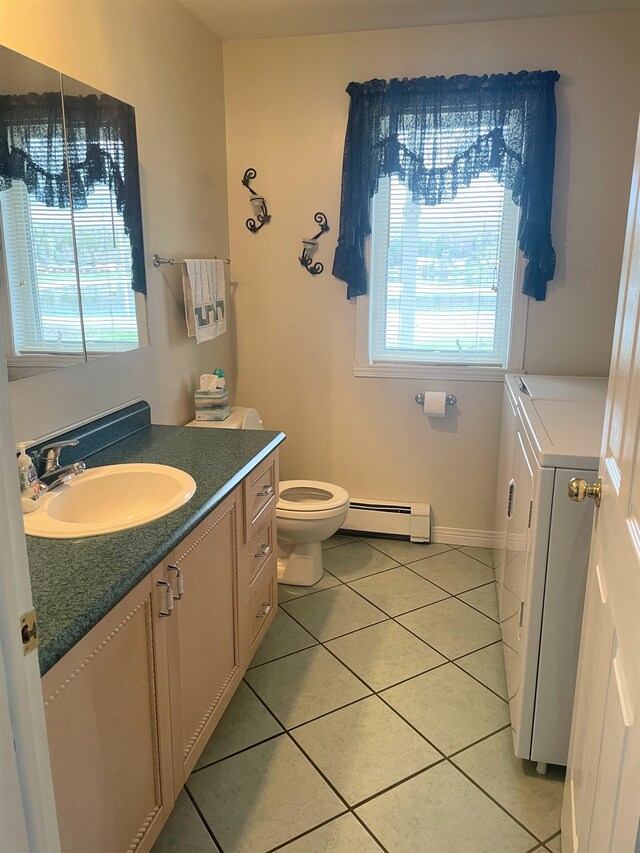 bathroom with tile patterned flooring, a baseboard radiator, plenty of natural light, and toilet