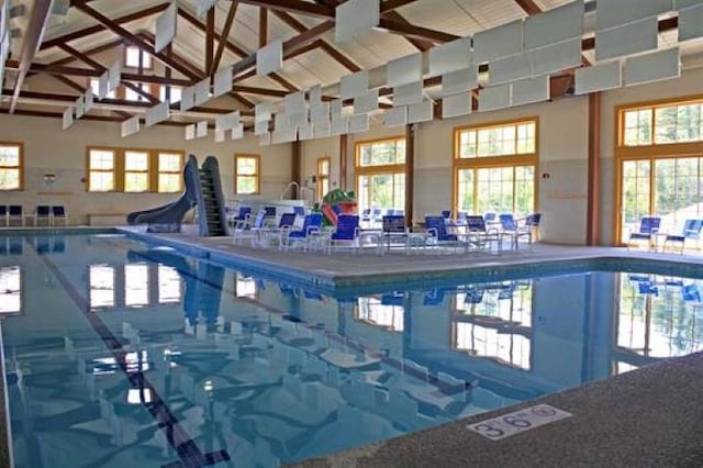 community pool featuring a water slide