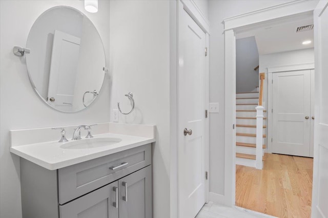 bathroom with vanity and wood-type flooring