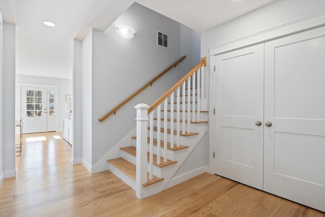 stairway featuring hardwood / wood-style flooring