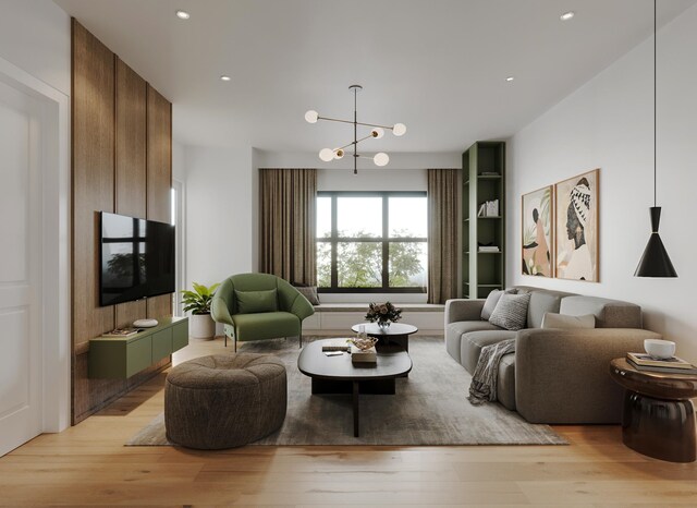 living room with an inviting chandelier and light hardwood / wood-style flooring